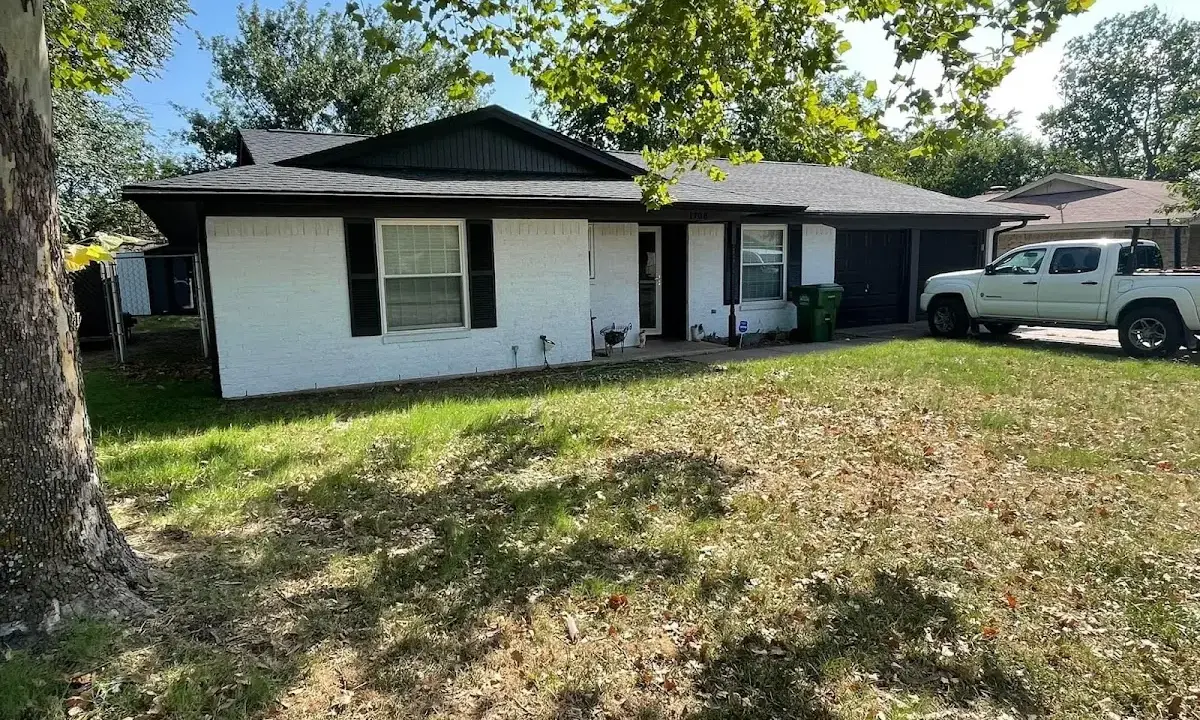 Professional roofing crew working on a residential roof in Liberty Hill